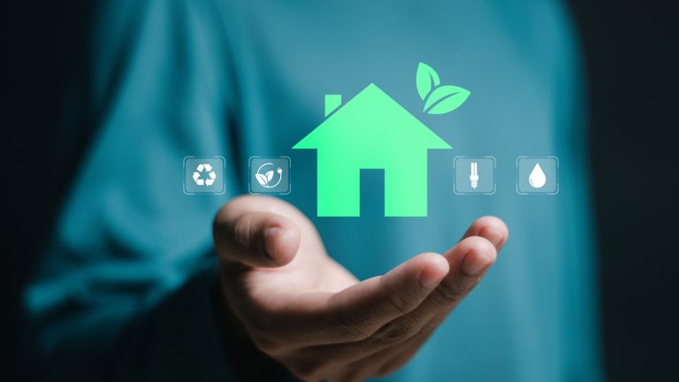 Hand with eco house and recycle le, recharge, lightbulb and heating icons Energy-saving expert providing advice to UK homeowners